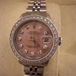 Rolex Women's custom 18K WG Diamond Bezel added Genuine Diamonds.